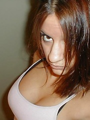 Hot brunette chick playing with a dildo