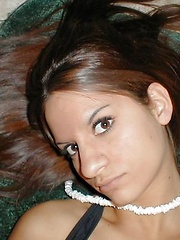 Hot brunette chick playing with a dildo