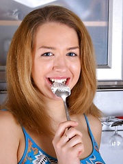 A horny kitchen beauty creaming her cute teenage nipples